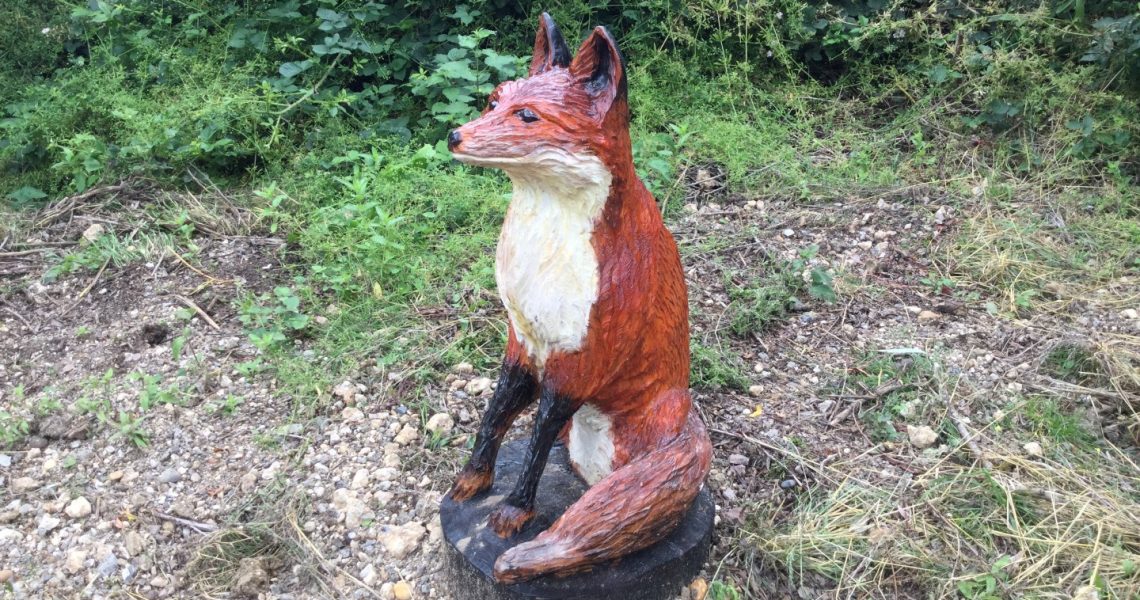 fox carving in forest