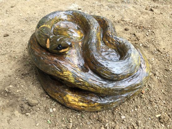snake carving coiled wooden sculpture rushden lakes